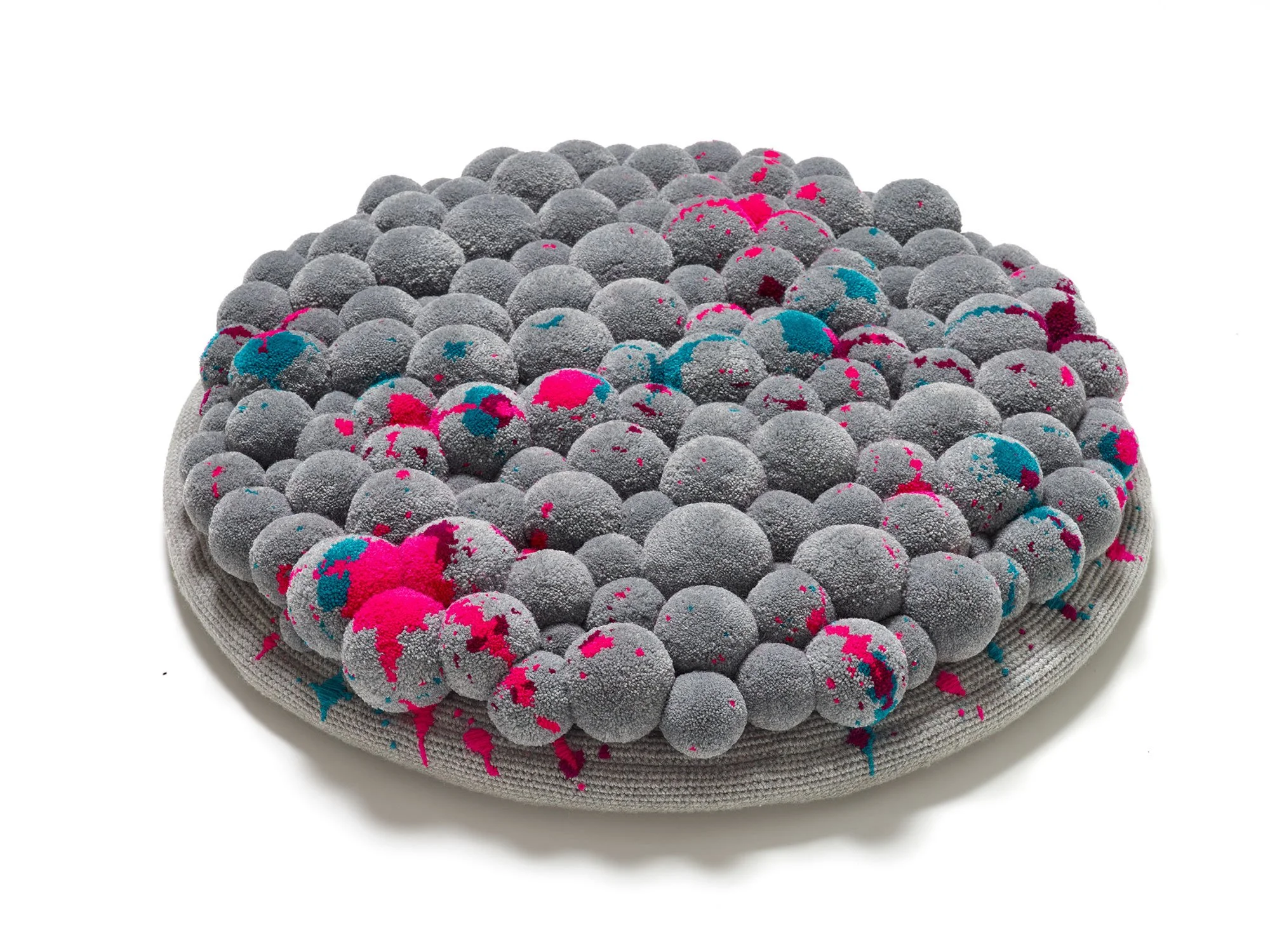 Pompon floor cushion splashes
