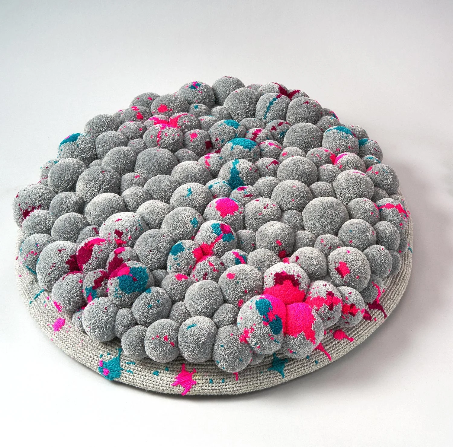 Pompon floor cushion splashes top