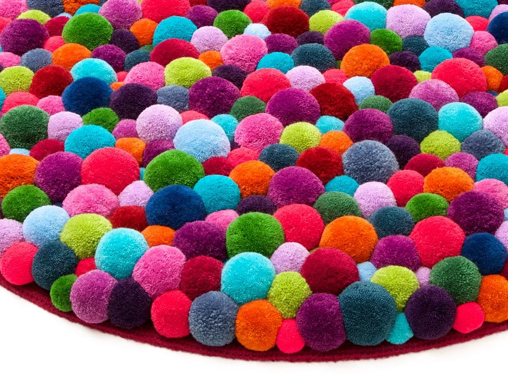 Pompon carpet multicolor closeup 