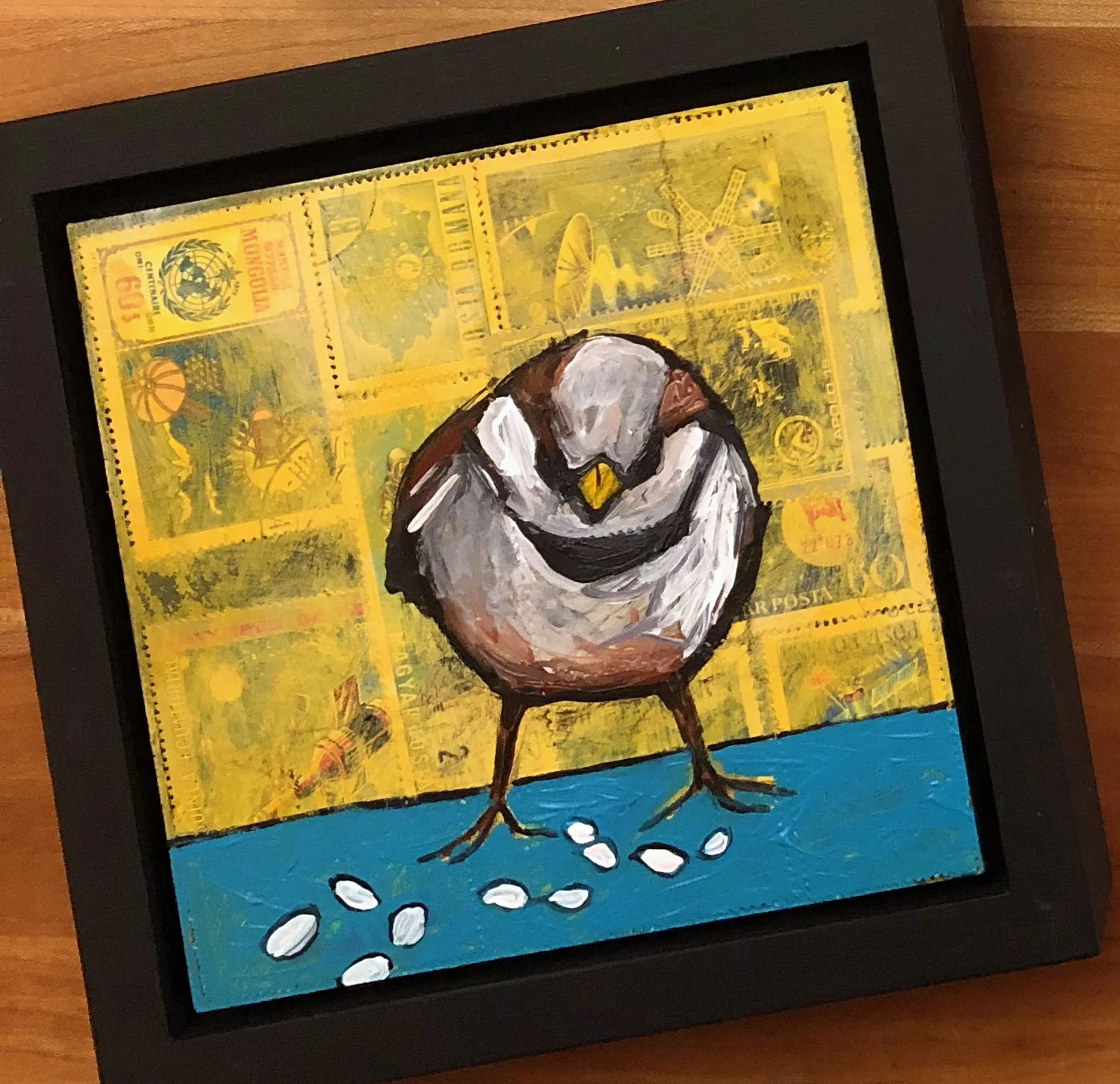 postal stamps and acrylic on wood, 6.5" x 6.5" (including frame), wood frame is 1.5 inches deep and made locally