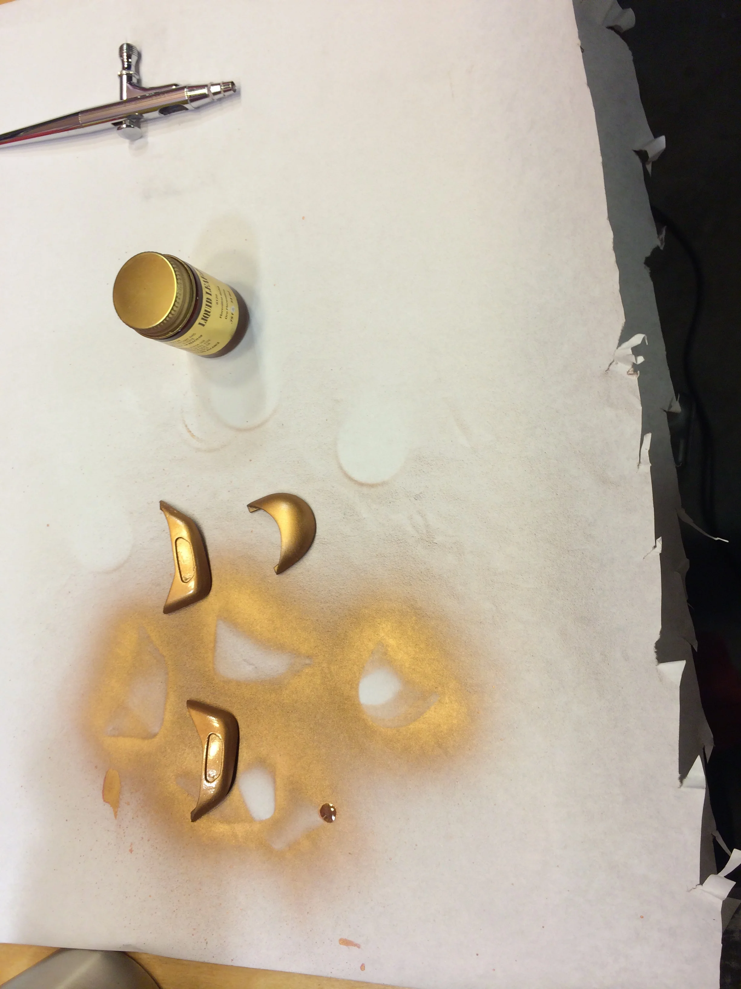 The liquid leaf paint I used is metallic and in my experience metallics aren't the best for these little airbrushes because the hole that the paint comes out is so tiny the flakes can clog it, or at least prevent good atomization. You can get different size needles and tips too. I wasn't concerned since these things are small.