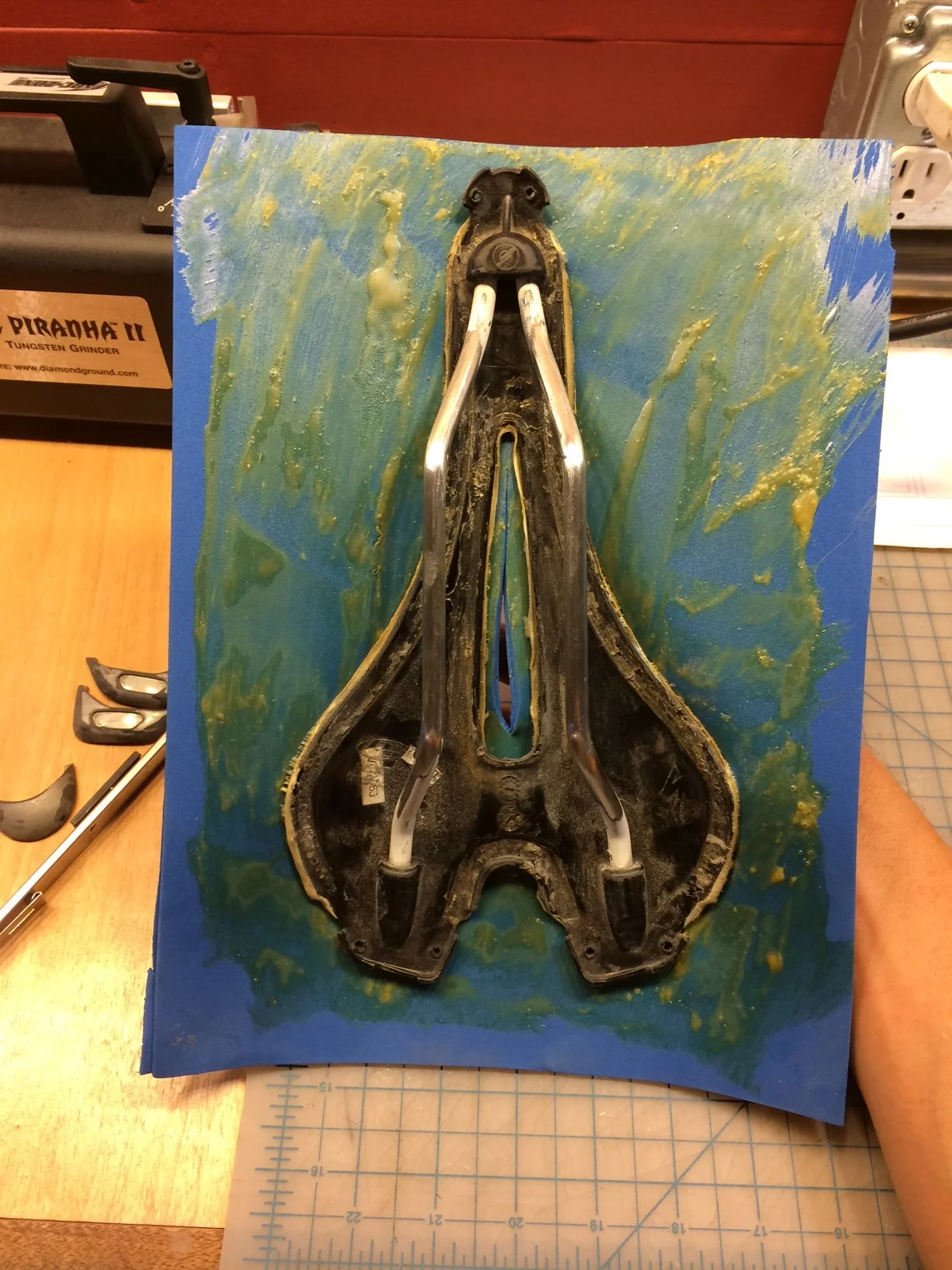 By laying the material on the table the way I did and applying the complex curve item it sticks on the high parts. From there I work the material on working out from those contact points. Oh, in this picture you can see the holes that the plastic tabs use to indicate.