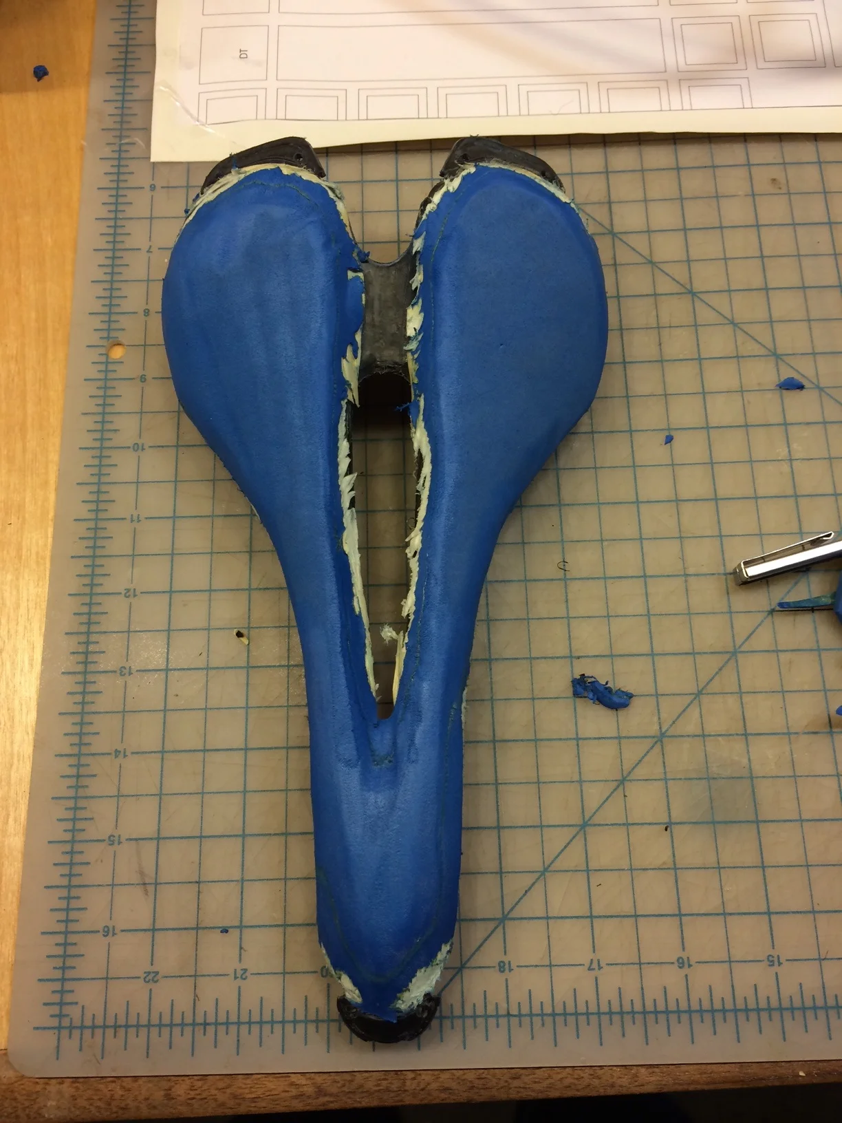 After a bit of a cleaner cut I used a sander. Ideally I would use a bench belt sander but since I don't have one I had to make a compromise by using a flap wheel in a drill (then clamped it in the vise so it was stationary) After this picture I made a bit more in efforts to slim and refine it.