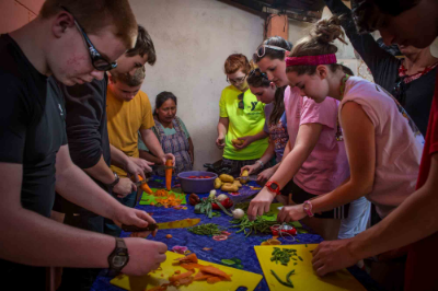Prepping the vegetables for the pepian.