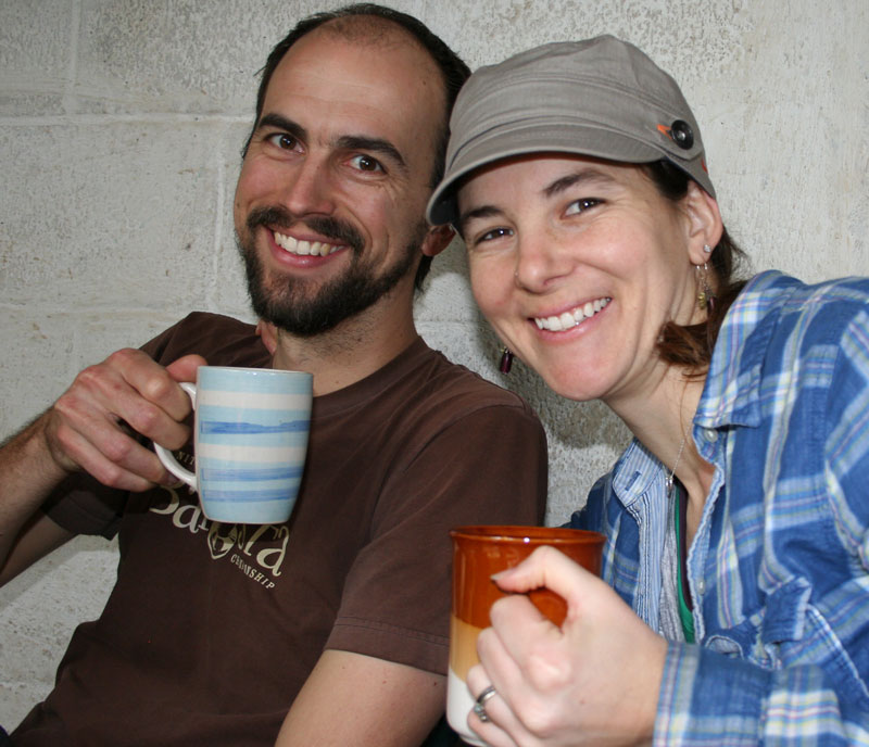 Les and Jamie from Deeper Roots Coffee enjoying coffee at a farmer's house in Huehuetenango.