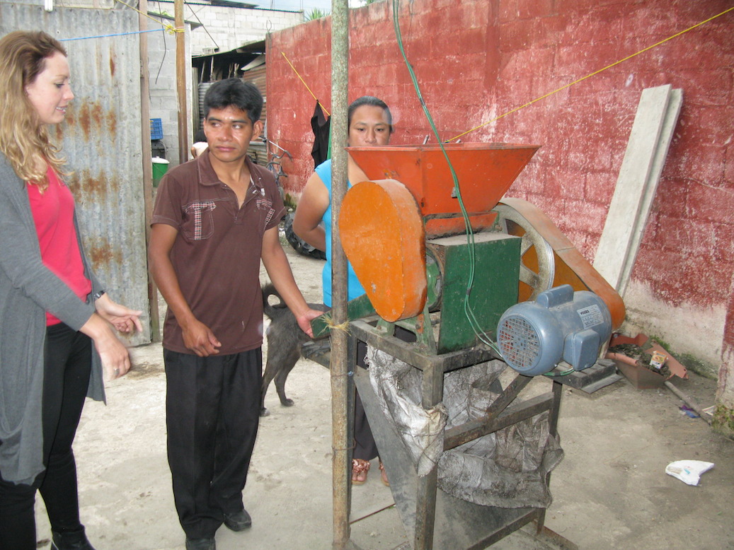 Armando and Virgilia demonstrate the motorized pulpero, which they use to remove the pulp from the red, mature coffee fruits.