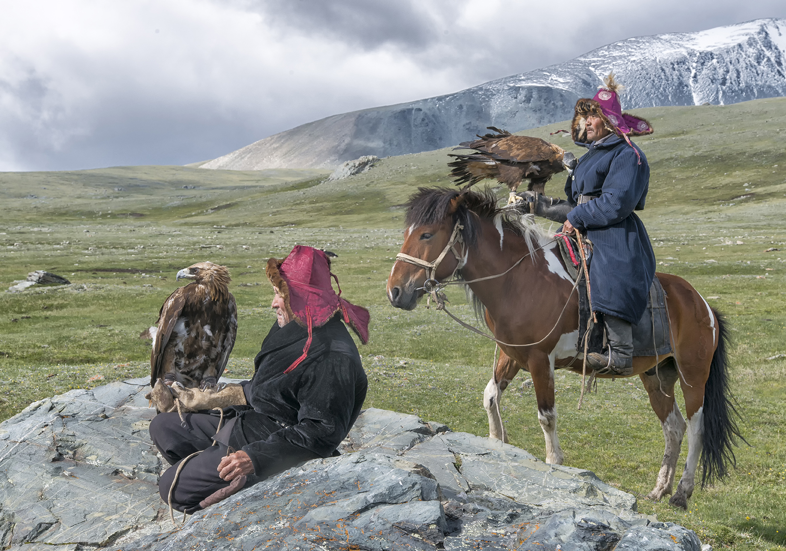 Mongolian Kazakh Eagle Hunters in the mountains.jpg