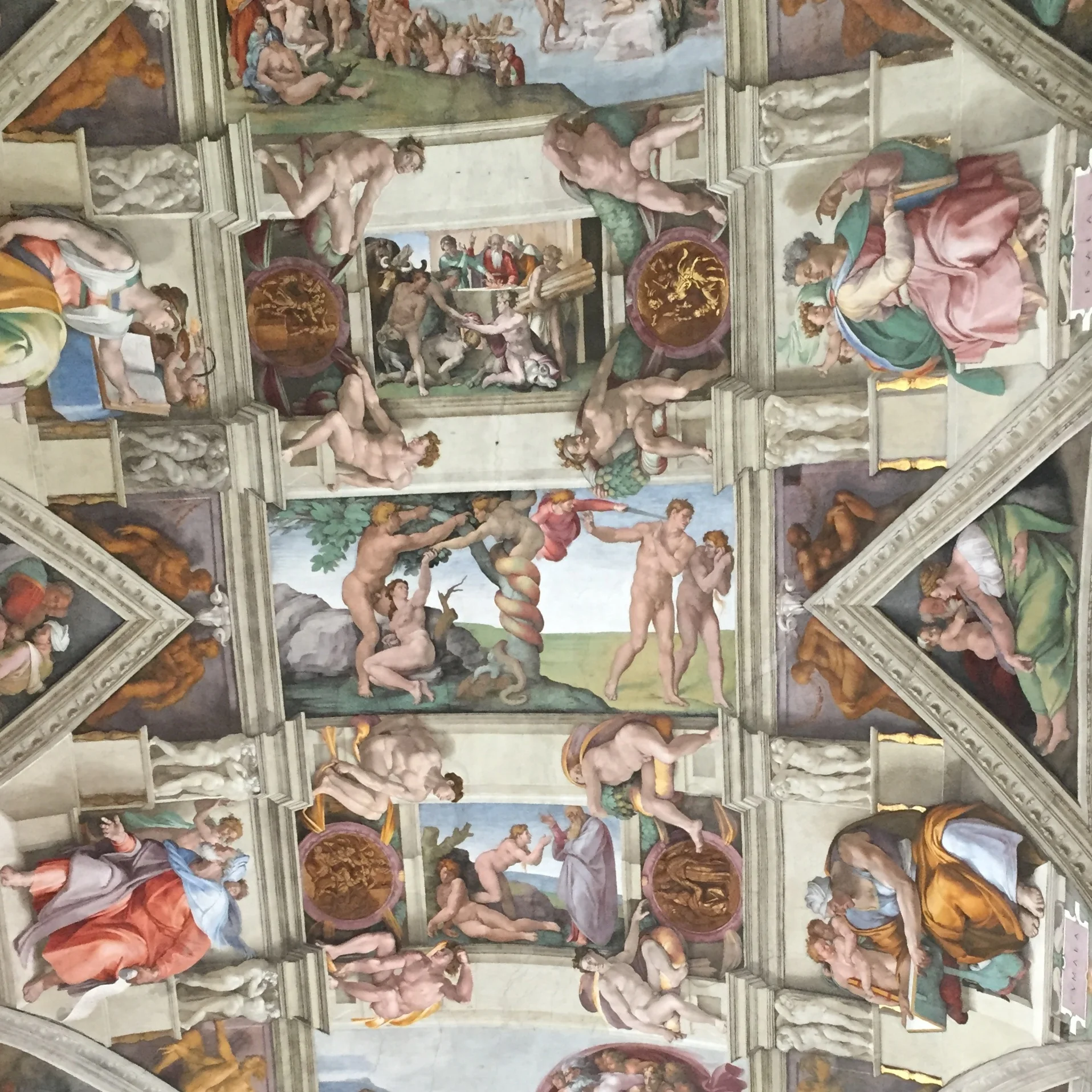 Michelangelo devised a system of organizing the ceiling frescoes painting in architectural elements using a technique called trompe l’oeil — to fool the eye. It is all pigment and plaster.