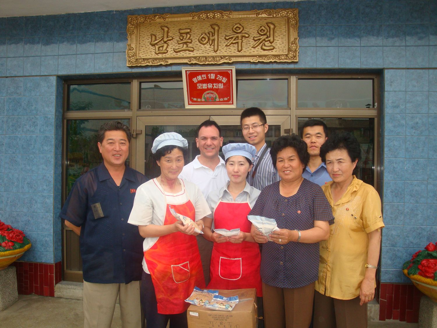 Donating Mannapack food packages to the Pyongsong Orphanage.