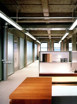  The corporate headquarters for Holly Hunt Ltd. integrates the Design Studio, the Collection Staff, and the Accounting Division into a single, flexible workplace.  Raw brick walls, an exposed concrete frame, and expansive views of the city define the