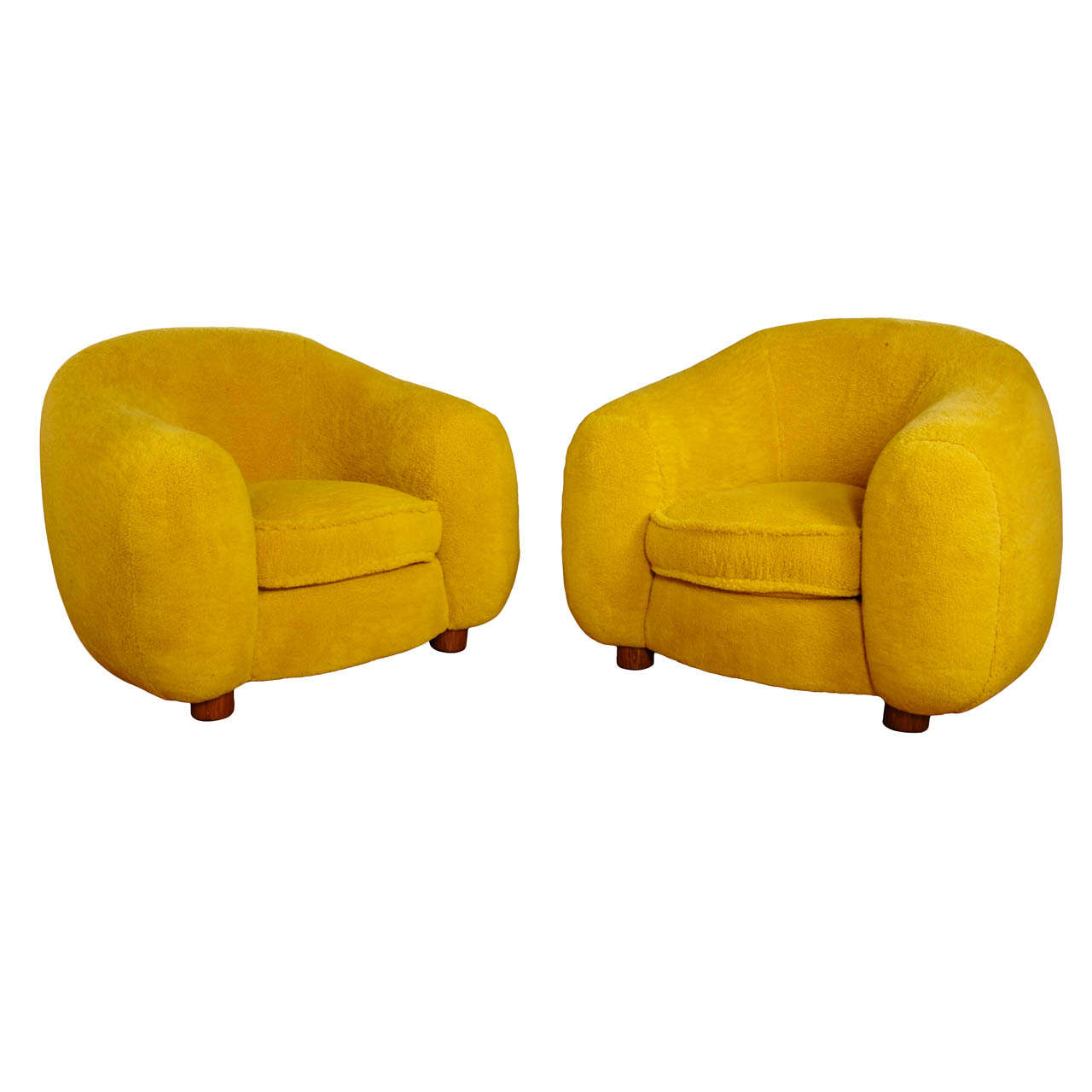 pair of yellow chairs by jean royere