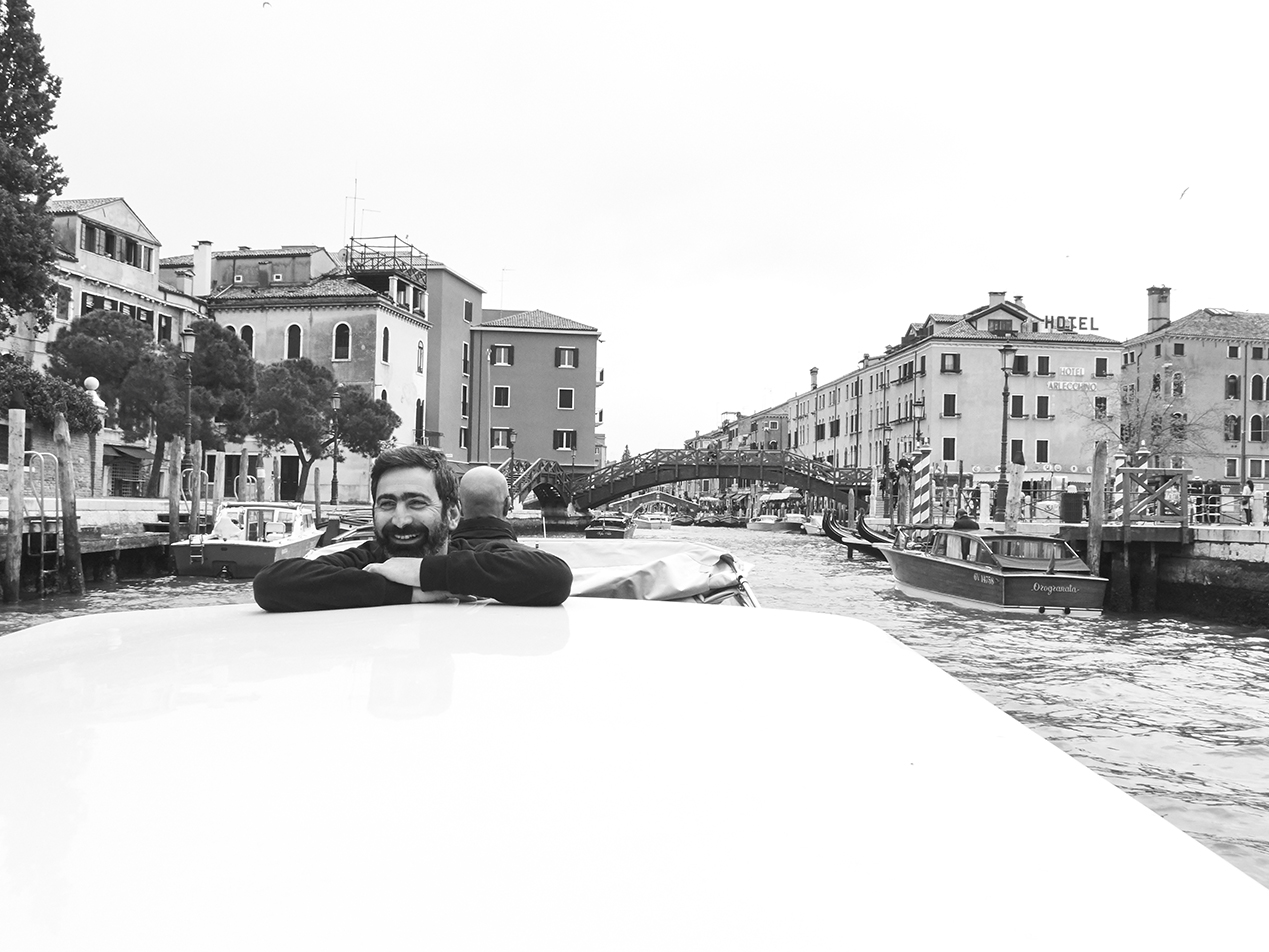 Travelling at night, living in the daytime, the world is here, where we are now, sharing a boat taxi with Yuri Ancarani on our way to enjoy a breakfast at Cafe’ Florian in Venice.