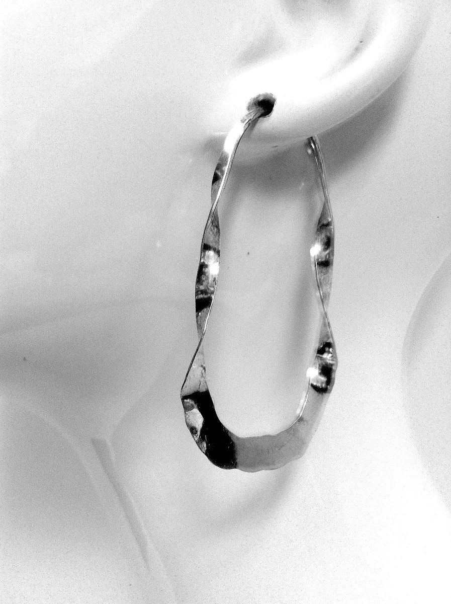 Twisted oval earring on mannequin