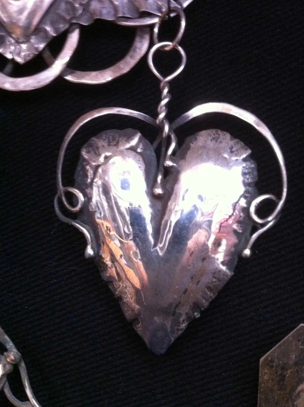 Silver Heart with twisted arms that hold forever