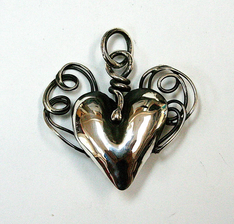 Silver Heart with arms   different view white back ground