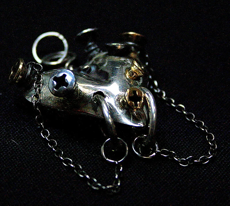 Screwed Heart with chains and piercings