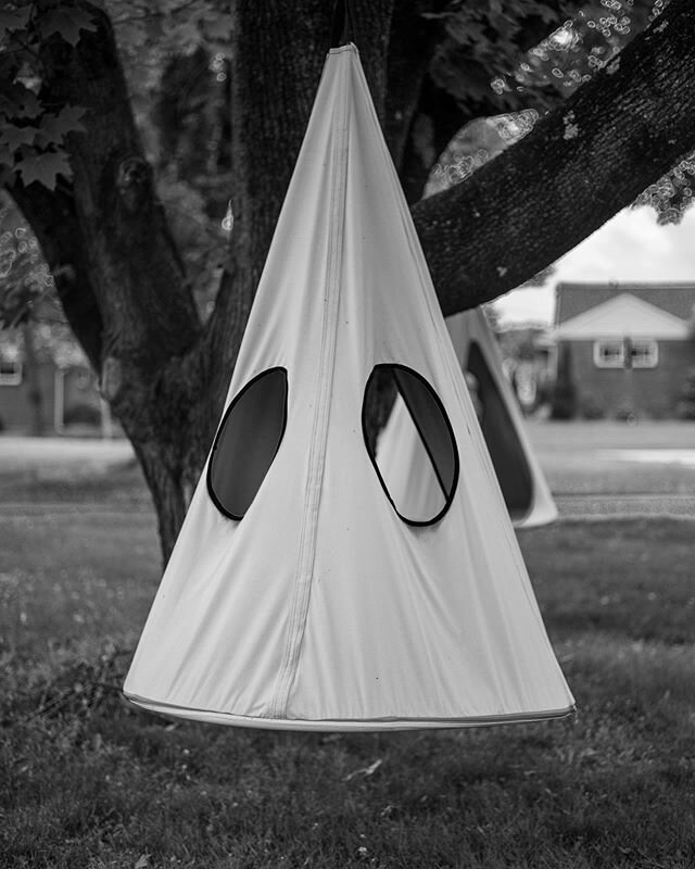 Suburban Philadelphia, June 2020. A perfect illustration of the differences among seeing in B&amp;W; seeing in color; and seeing both from another angle altogether. The first image is haunting: a giant KKK hood hanging from a tree. Same image in colo