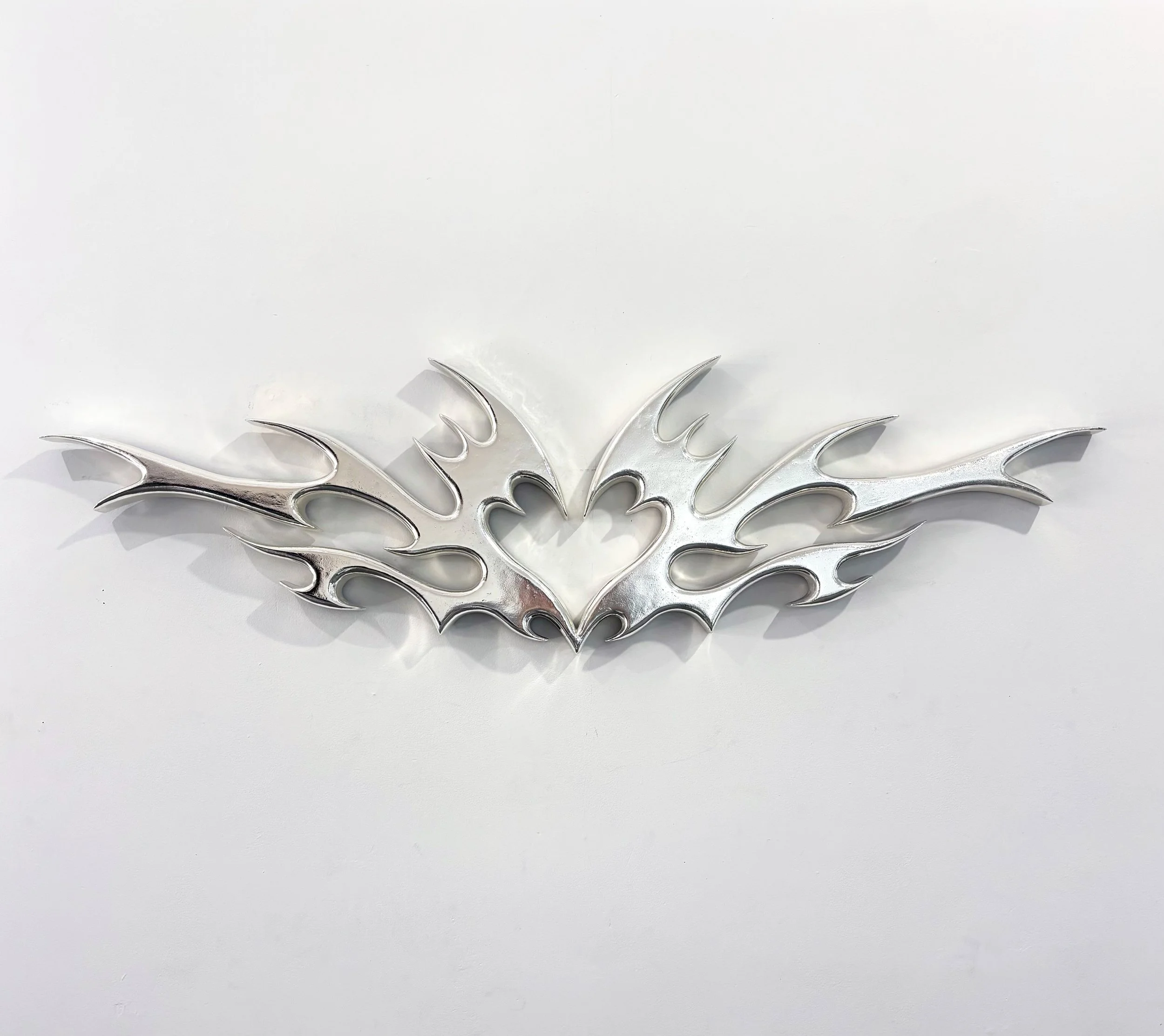  Stamp of Approval (Nights and Weekends)  Sterling silver chrome on polystyrene  16” x 46” x 2”  2025 