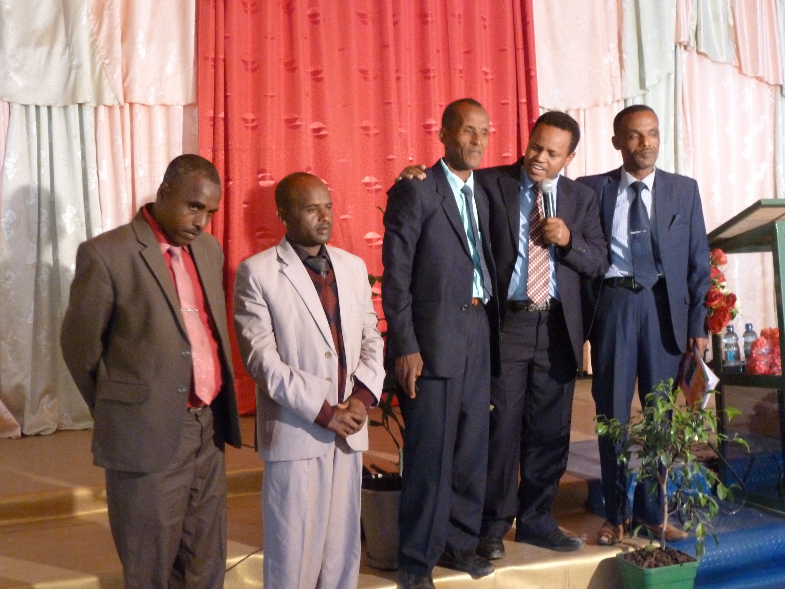 4 of our first pioneer evangelists with Mulugeta with the microphone, my right hand man