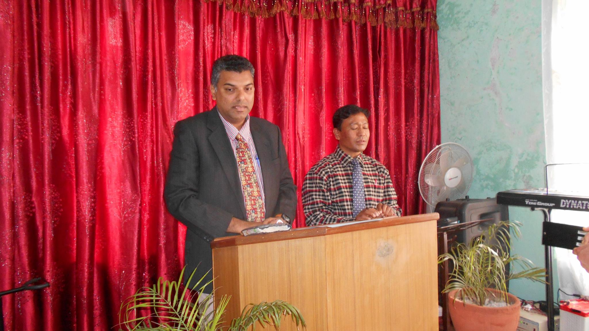 Nilesh preaching at Bhaktapur assembly with translation.