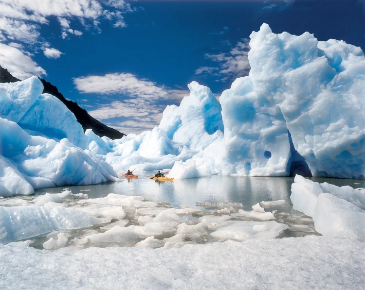 Kayaking in Lago Grey, Photographed by Jorg Badura