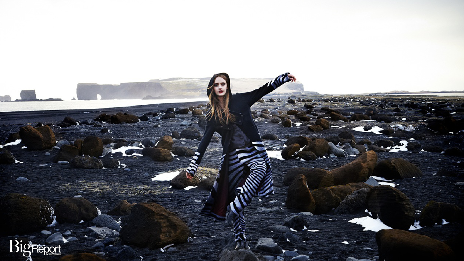 We have entered a new era of fashion where the dominance of Paris, Milan and New York is being boldly eroded by a new tribe of talented designers emerging from every continent, whose creations are best appreciated in their home towns. The latest stylistic boomtown is Reykjavik, whose fashion is a visual expression of its citizens’ gutsy energy, protective clothing, all-night partying and, above all, the uniquely bold beauty of its thoroughly offbeat women. Most fashion shoots are set in East Village lofts or before the Eiffel Tower in Paris or on a drank street in Hackney to impress the readers by their alleged cool. That’s completely wrong. To support our new era of regional fashion – where inventive designers are springing up everywhere from Tbilisi and Riga to Rio and Reykjavik – these new talents need to be seen it in their true context. That’s why using the raw beauty of Iceland; its bluff drama, its rolling skies, its tumultuous topography, its avant-garde tailoring and the incendiary beauty of its women is so much cooler and better. This dramatic Dreamland Journey shoot never falls into the classic mistake of attempting of be more than it is. Instead, Dreamland Journey is an honest, living reflection of the funky, earthy panache that is this rare jewel of an island isolated in the turbulence and mist of the north Atlantic. No wonder photographer Erez Sebag and stylist Edda Gudmun stayed in Iceland, heading out of its capital to the country’s southern most city, Vik I Myrdal, whose black basalt sand beach gets attacked by giant Atlantic rollers. Its fingers of basalt rock formed into giant cliff sentinels, were an ideal setting for the graphic elegance that is Icelandic chic, and the country’s two most energetic designers – Hildur Yeoman and Mundi. This spring, in my first trip to ballsy badass Reykjavik and its once-a-year fashion festival I caught up with Hildur Yeoman, whose stellar showed featured a brilliant life version of Olivia Newtown Jones bubble gum dance classic Xanadu. Staged in Harpa, the beautiful dimpled glass concert and theater complex located at the atmospheric Old Port, Yeoman’s tribal babe vixens from the north go to an after party in a naughty after-hours bar was pretty damned brilliant. As was a blooming great show by Mundi, who rocked out in the basement parking of Harpa in a post-Armageddon collection, where the black and white graphic apparel had poise and practicality – tough chic to fend off a icy street corner wind, cool clobber for the inner circle. A beautiful video by Mundi featured the actual clothes worn on models in the stunning Elliaarhraun lava fields, with shaven head scene stealer, Aron Bergmann Magnusson in the starring role as chiseled jaw beauties indulged in bizarre blue blood drinking rituals. Just the sort of lovely lassie Irish poets want to bring home to meet their mothers for Sunday lunch. No wonder Mundi and Aron became good buddies, two bold dandies with enough style and alcohol capacity to drink with an Irish writer. Our Dreamland Journey was based around Mundi’s remote farmhouse, which is to Iceland what Karl’s Biarritz villa or Donatella’s via Gesu palazzo is to their cultures – i.e. the insiders’ ultimate hangout. They were not the only designers to tastefully attire the local Icelandic women and their beautiful soft eyed, yet fierce lipped, allure. I could also only admire Ziska, by Harpa Einarsdottir, an exotic local artist whose cross of skinny Nordic rocker, mystical tales, faux Viking tattoos and dramatic crocheted black wool designs was dementedly cool and out there. And when in Iceland do check out Kormaks & Skjoldur, a gentlemanly duo whose basement store on the city's main shopping Mecca, Kjorgardur. Call it patrician chic for highland rambles and whisky fueled dinner parties. In other words, an Icelandic must-see. Reykjavik Chic is all about stupendously funky parties, leggy local beauties, gloomy pink sunsets, silvery dawns and jagged silhouettes, best appreciated in this Dreamland Journey shoot. As you can tell I loved Iceland, ever outlandishly hip but always ultimately uber itself. Long may she stay that way, long may our fashion universe discover this chilly paradise of the north.