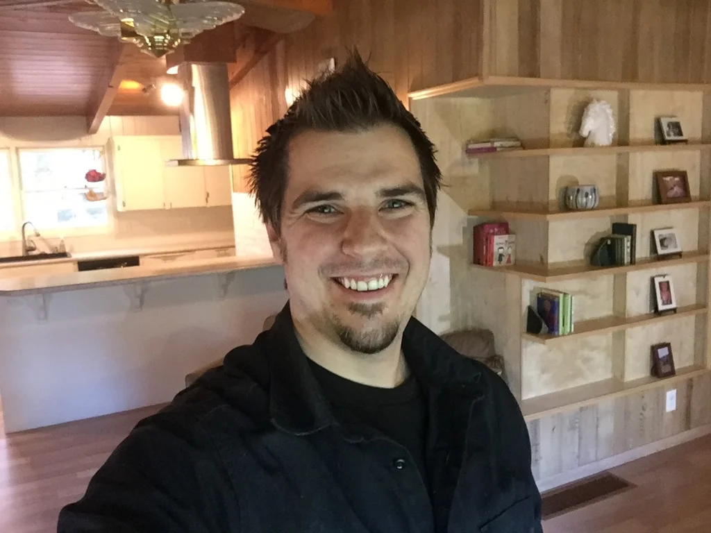 Brendan Hutchins crafted the corner built-in bookcase and remodeled the kitchen in the background.