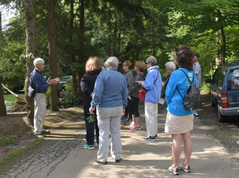 Jack Gulvin walks a group through the grounds on the south end