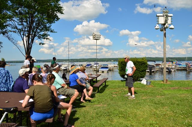 A crowd gathers lakeside every Friday at 4pm for a Purple Martin Chat