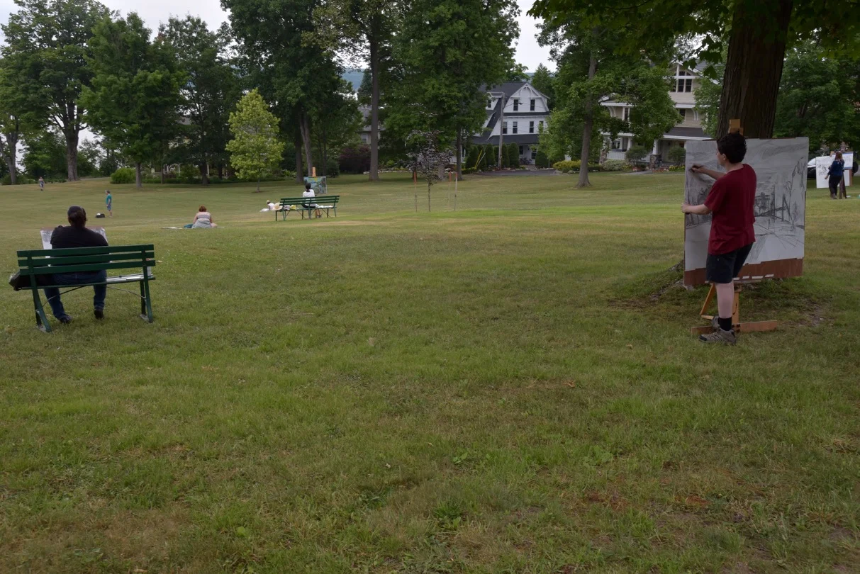 Students from the School of the Arts enjoy class outdoors on University Park.
