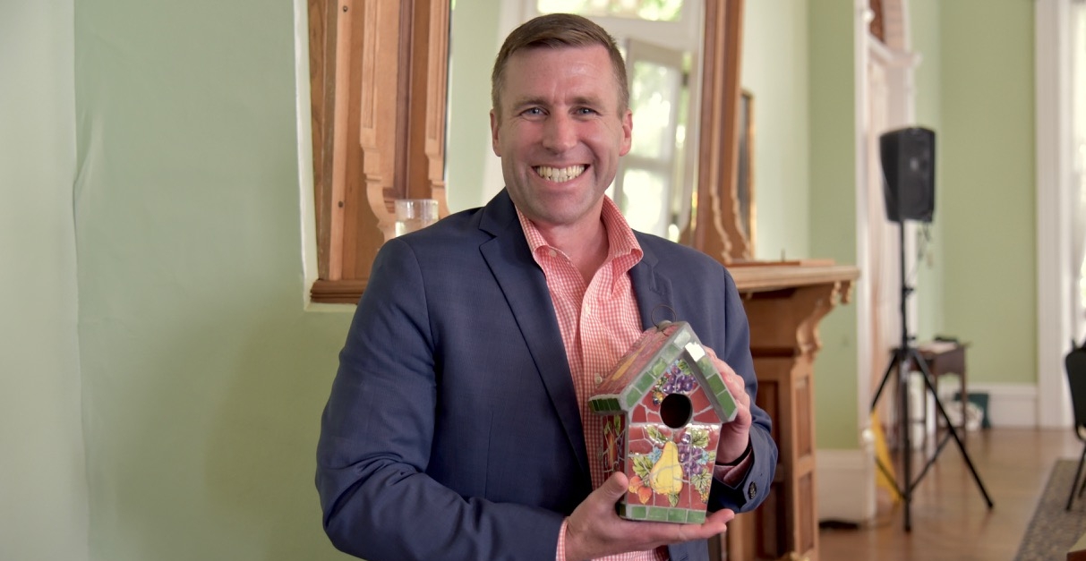 Institution President Michael Hill receives a bird house from BTG!