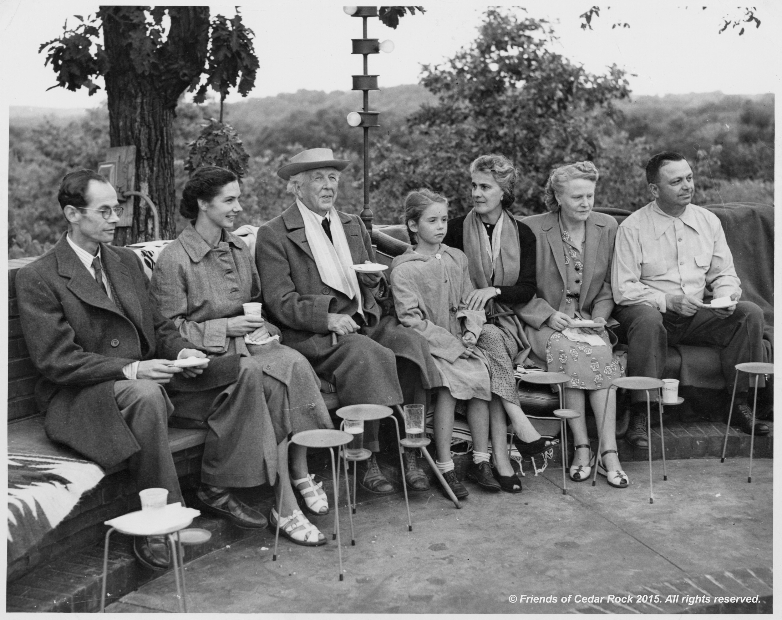 Lord and Lady Pentland , Frank Lloyd Wright, Olgivana Wright, Agnes and Lowell Walter celebrate the completion of the home around the council fire at Cedar Rock.