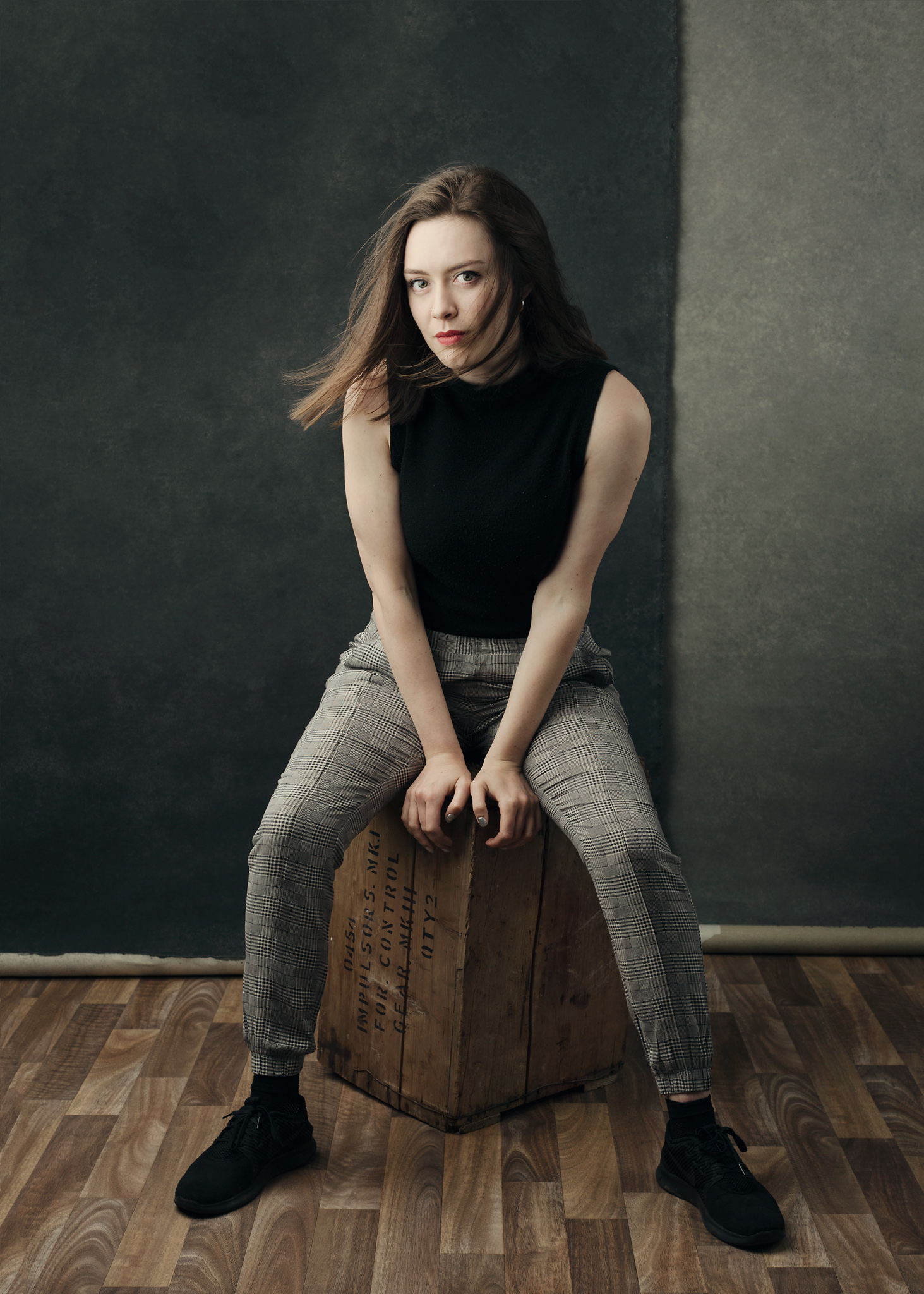 Rosie sitting on an apple box at our Bath photography studio