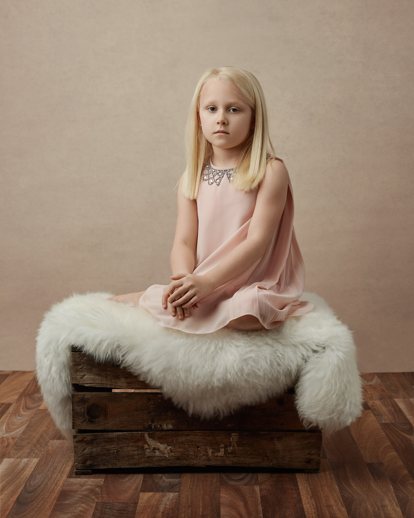 Lily posing on a wooden box