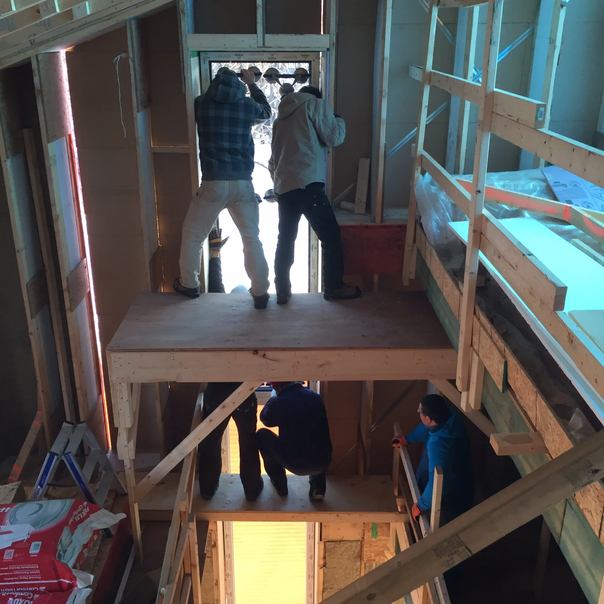 Upper glass goes in. 5 guys for this lift!