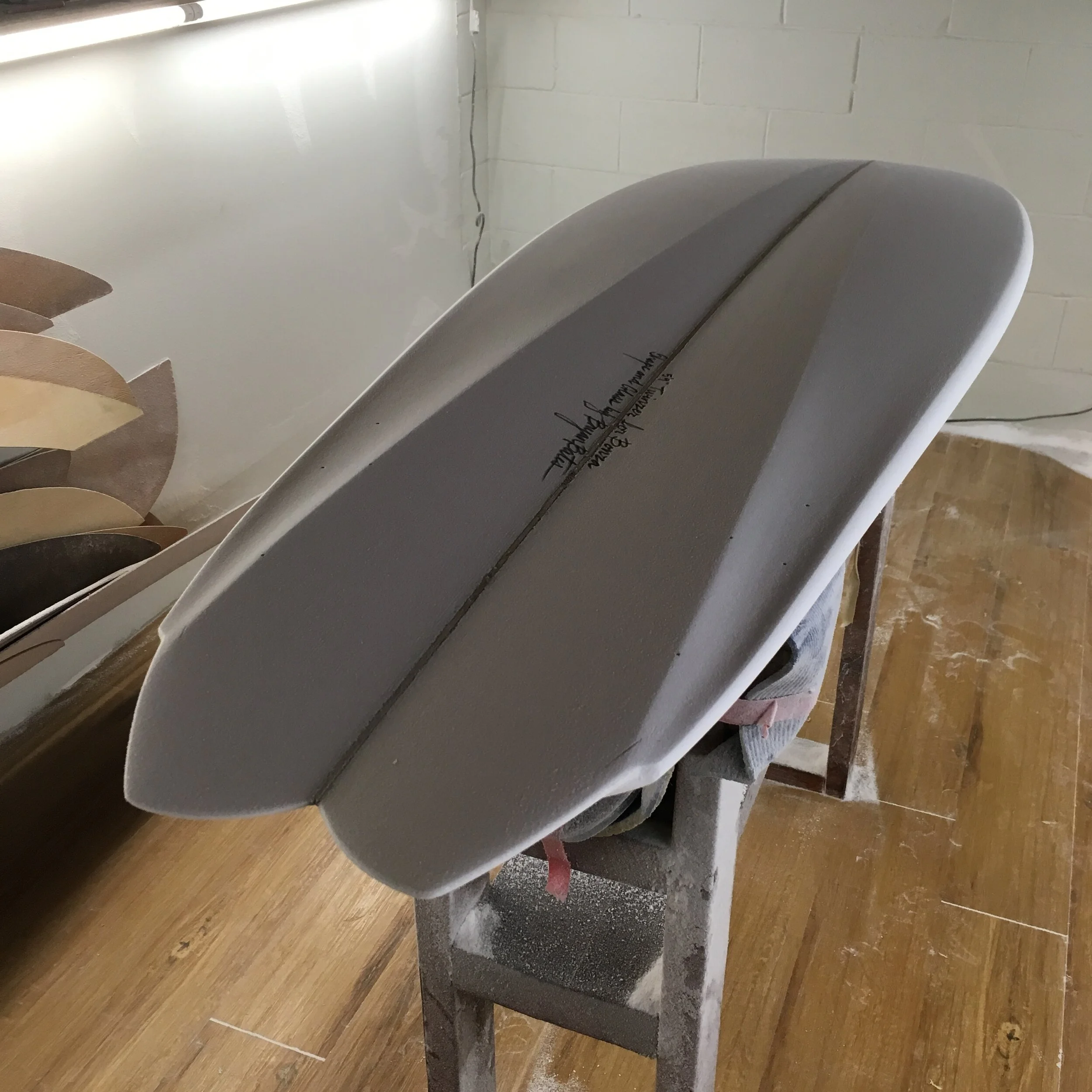 A 5’9” Tunnel Bottom Twinzer shape in the shaping room ready to glass.