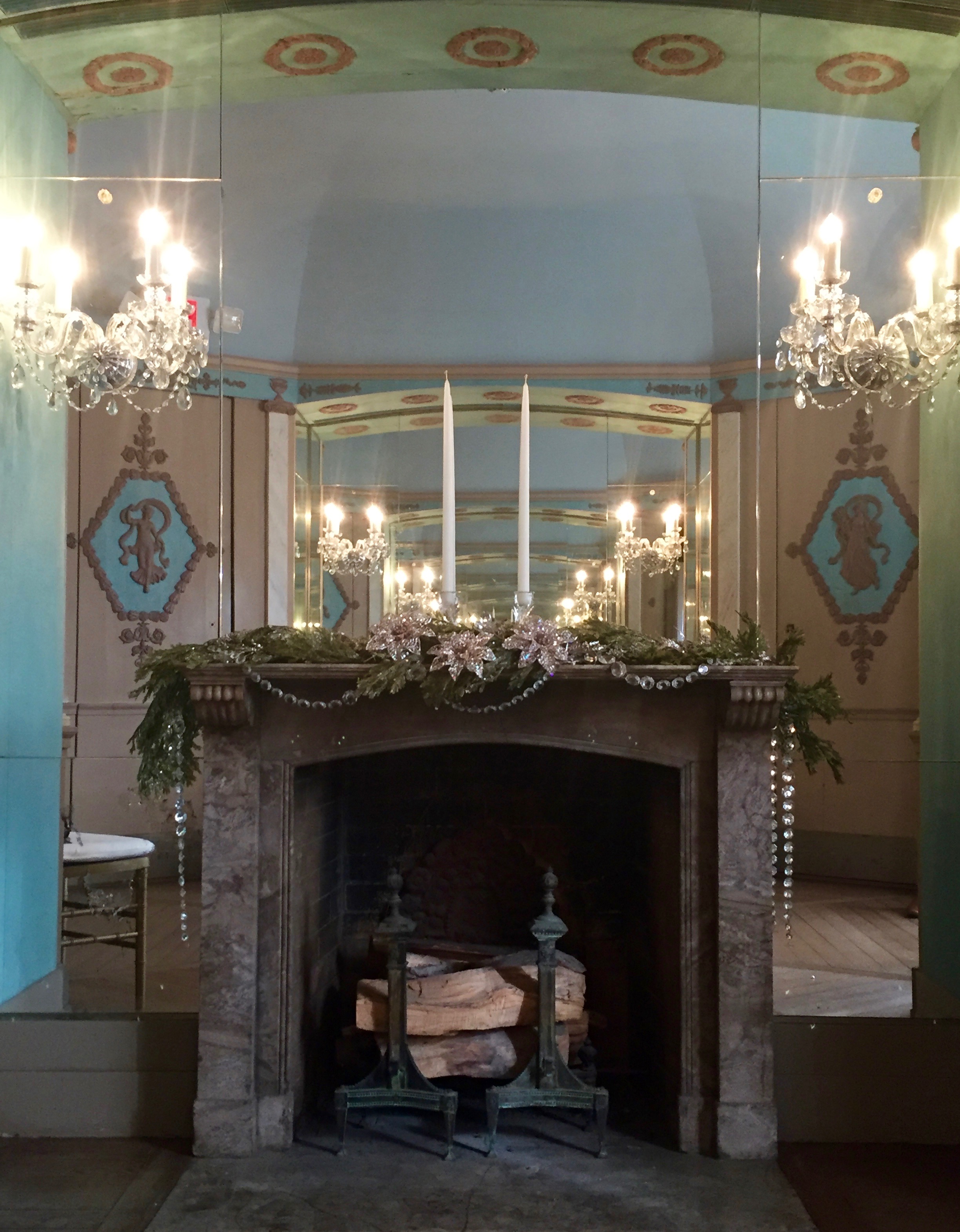 The fireplace in the Mrs. Vanderbilt's dressing room was topped with a simple green garland and draped in crystals to compliment the chandeliers in the room and on the necklace on the Christmas Dress. 