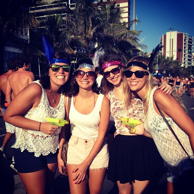 And (left) and her friends keeping cool and staying hydrated at Rio's Street Carnival.