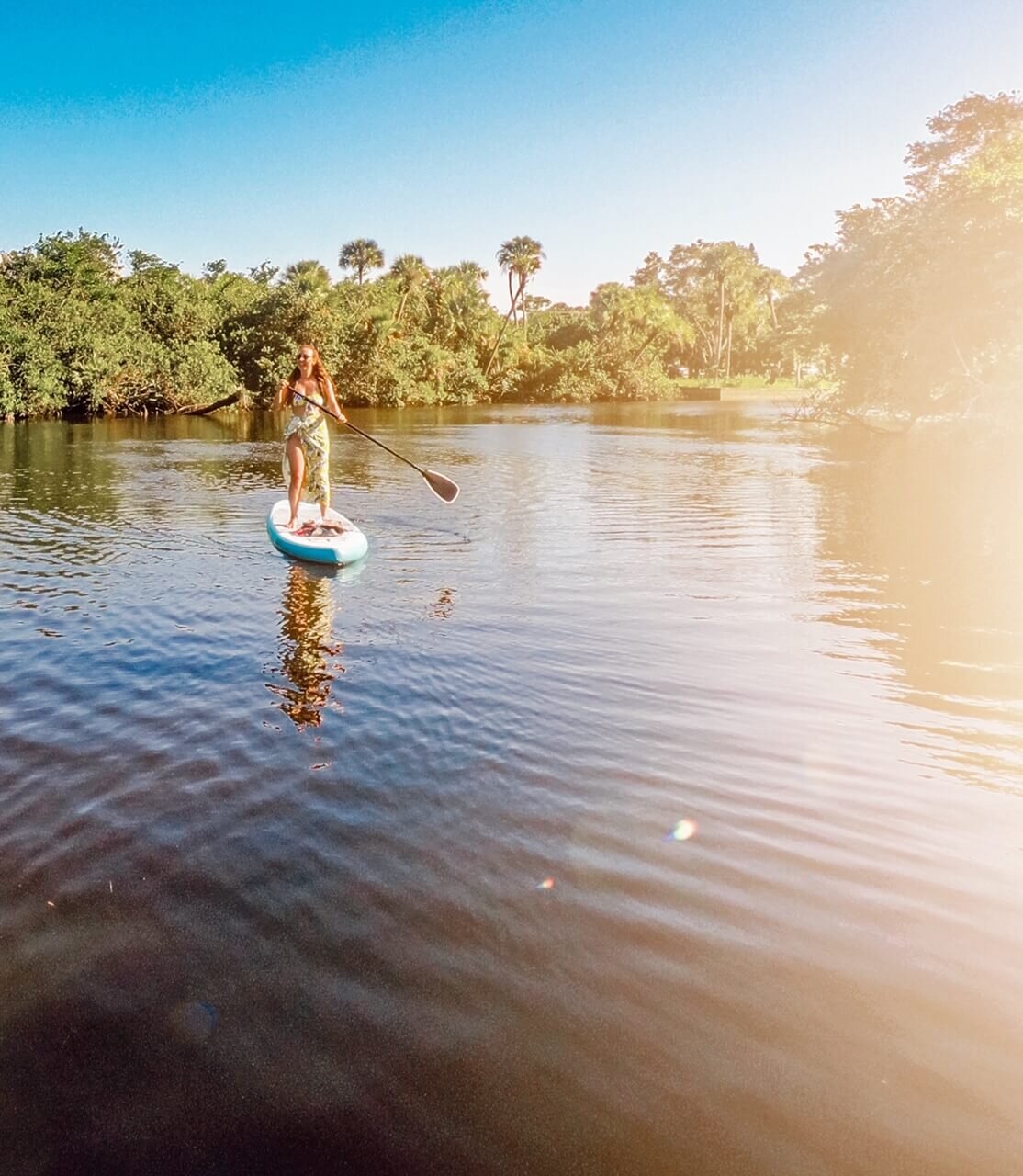 Valerie Trusted Travel Girl stand up paddleboarding on the st. Lucie River Best Things to Do in Stuart, Jensen Beach, and Martin County, Florida