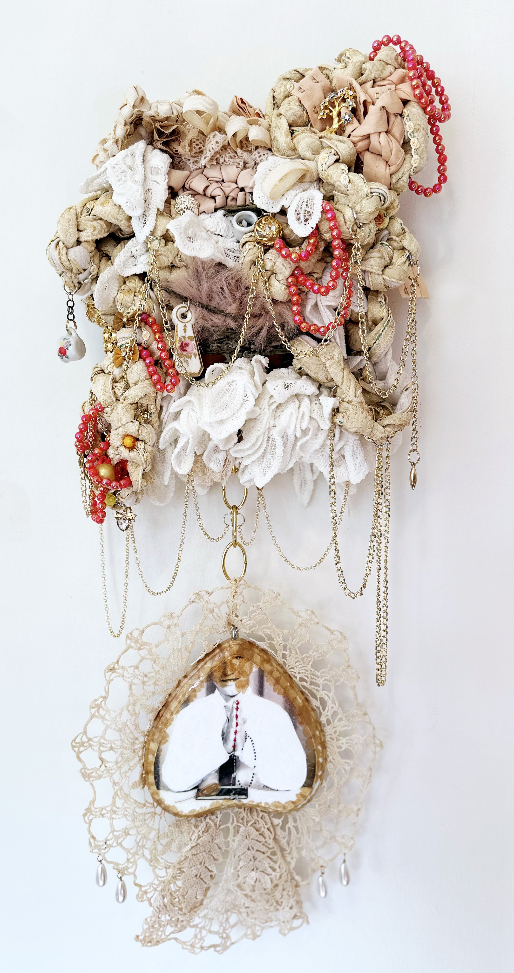 BrianAndrewWhiteley_We Enter on Love;_Collage, beads, trimmings, fabric, yarn, chains, mini porcelain keychains_33” x 14”_2024_StephanieMcGovern.jpeg