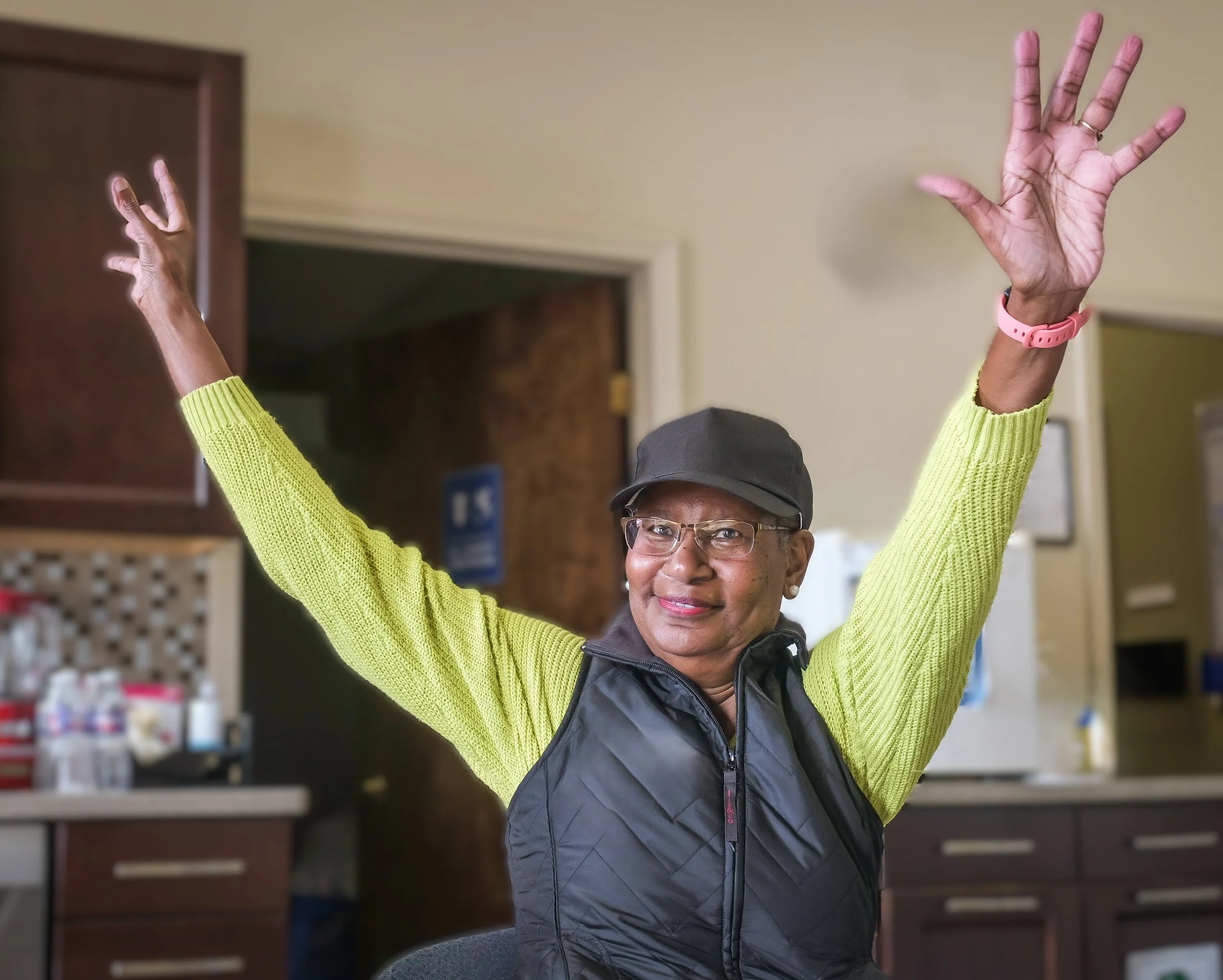 happy woman with hands in the air