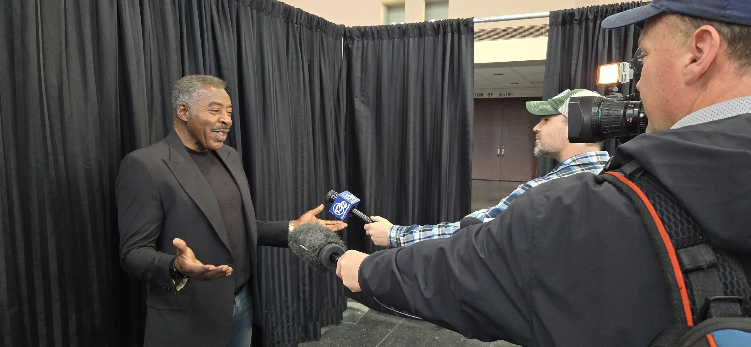Ernie with media.jpg