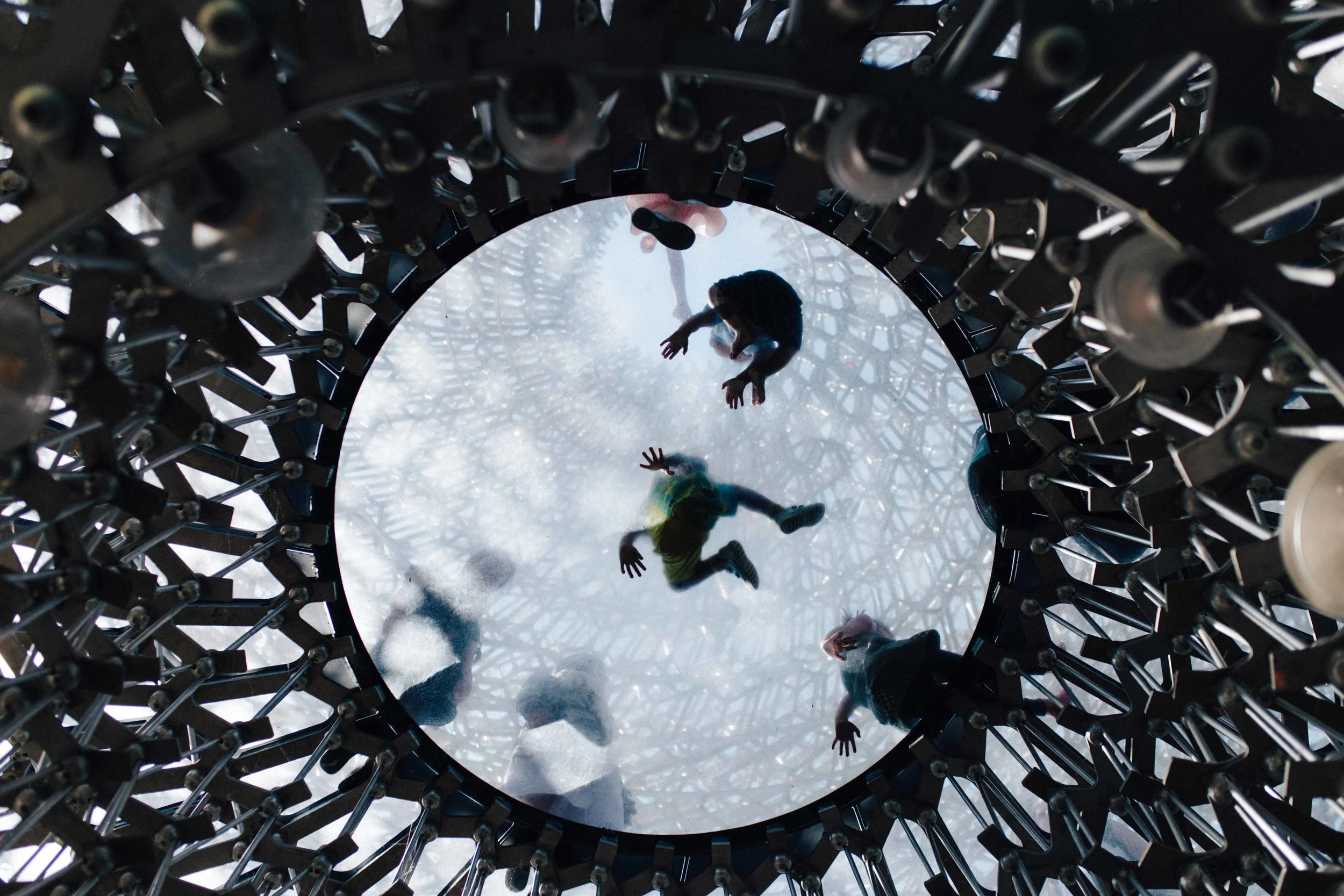 Children seen from below playing in The Hive in Kew Gardens, London