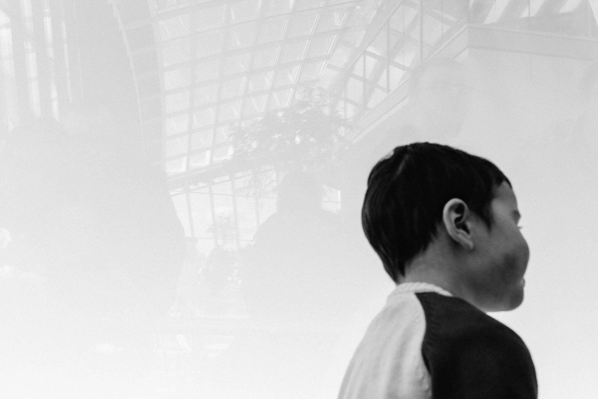 Profile of young boy with reflections of Skygarden in London