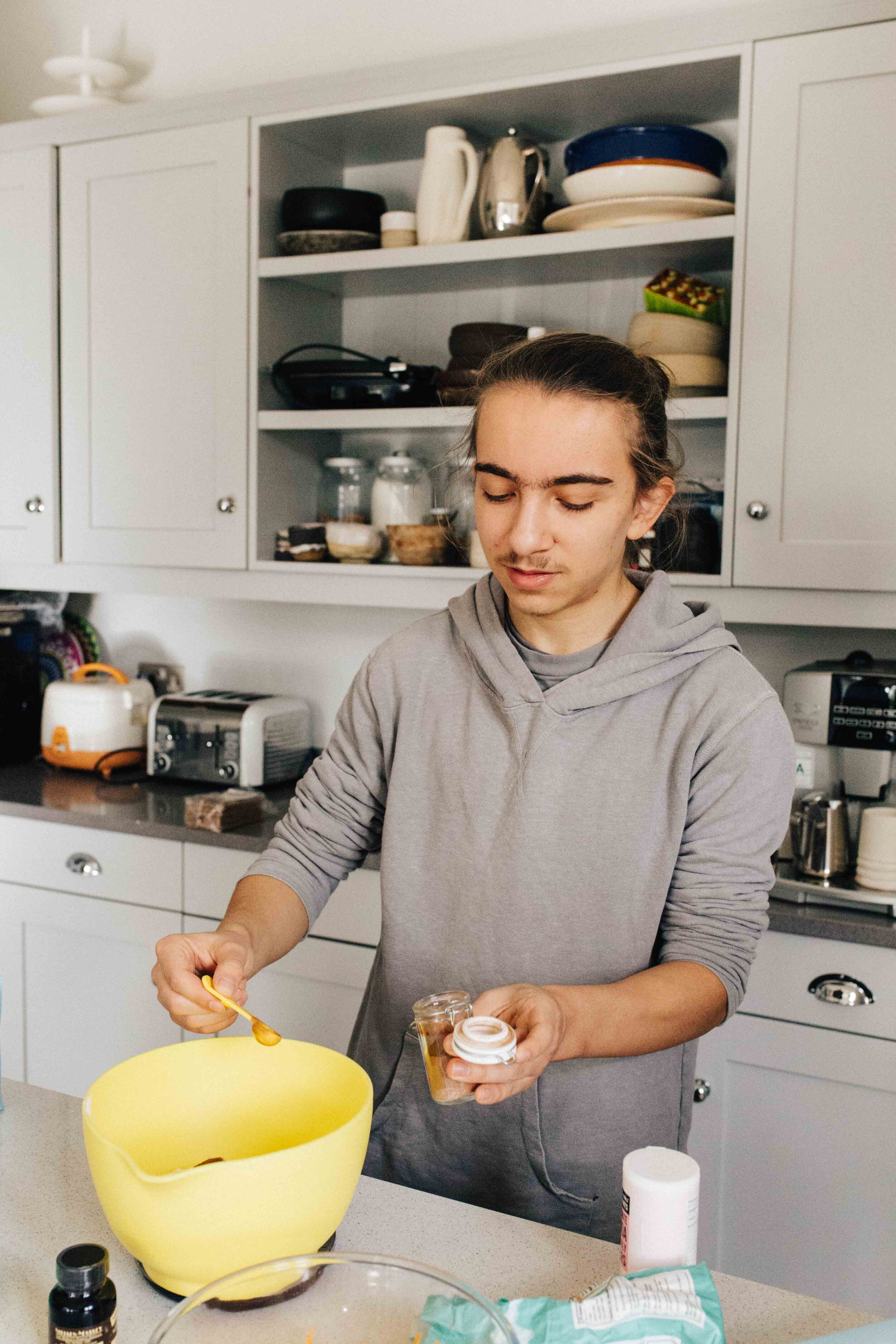 Teenage boy cooking