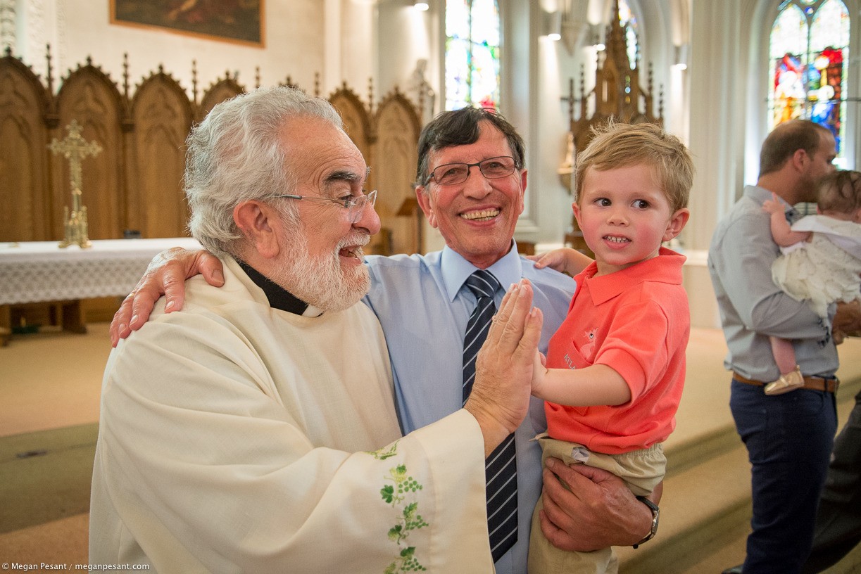 Alex high fives the priest