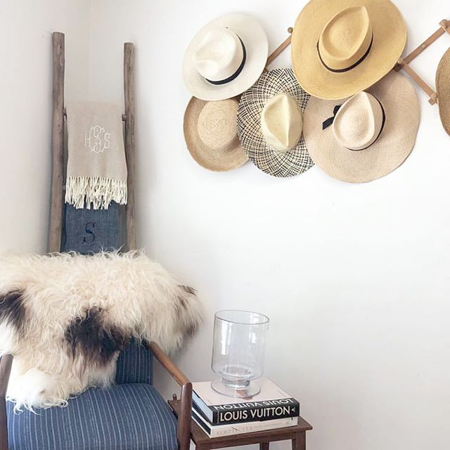 Monogrammed throws stacked on a ladder & ready to be used fireside or in the backyard! #themonogrammedhome #monogram #throwblankets #interiordesign #livingroomdecor
