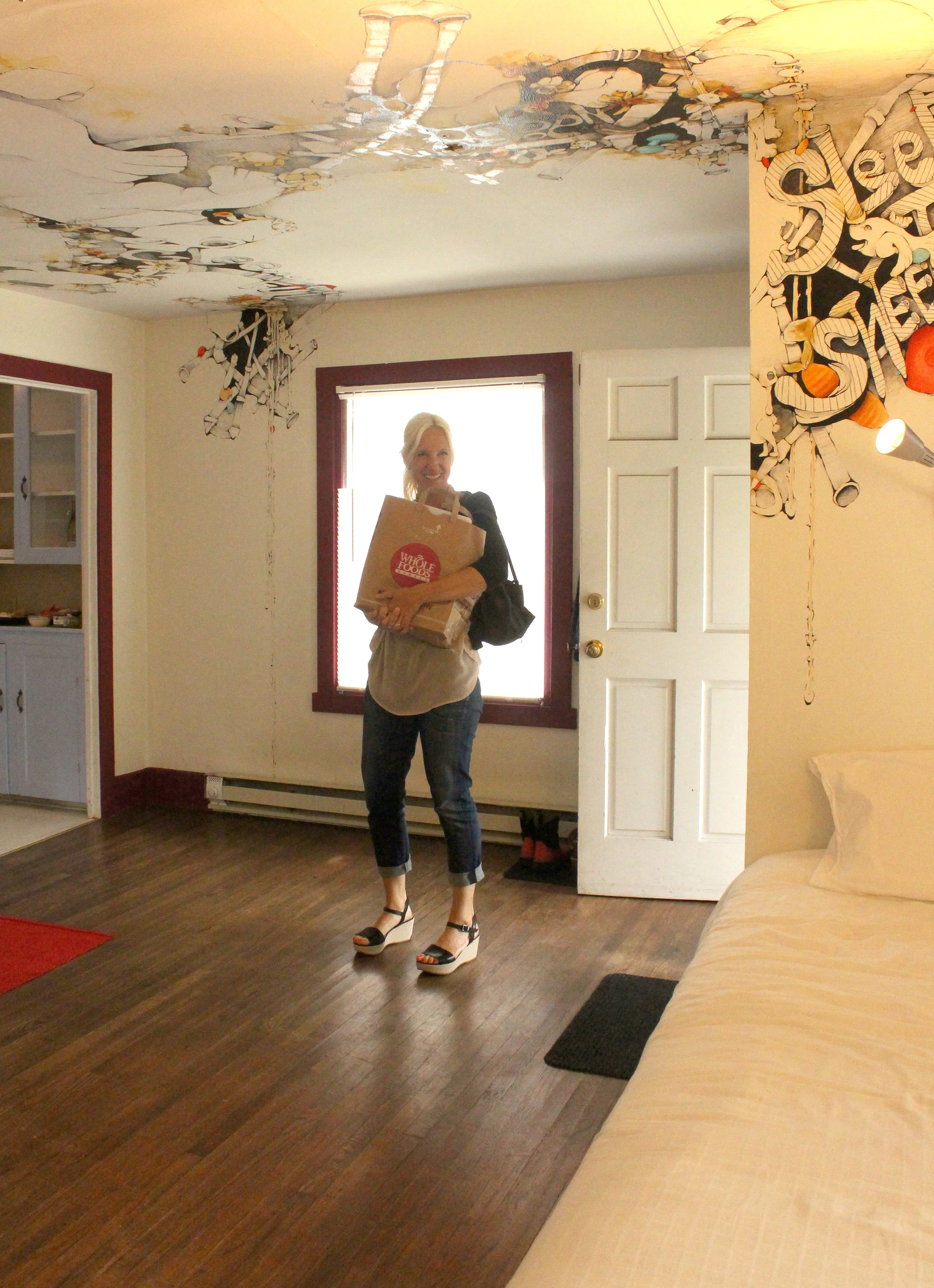 On July 20th I welcomed friends and family to come and say goodbye to both this wonderful house and my artwork. Here's Erika Eckert, both my long time dear friend and owner of the house, bringing some party goodies.