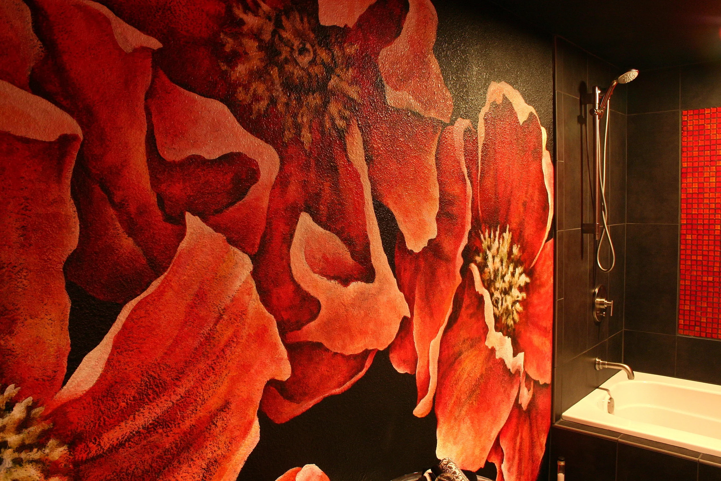 Poppies painted on black bathroom wall.