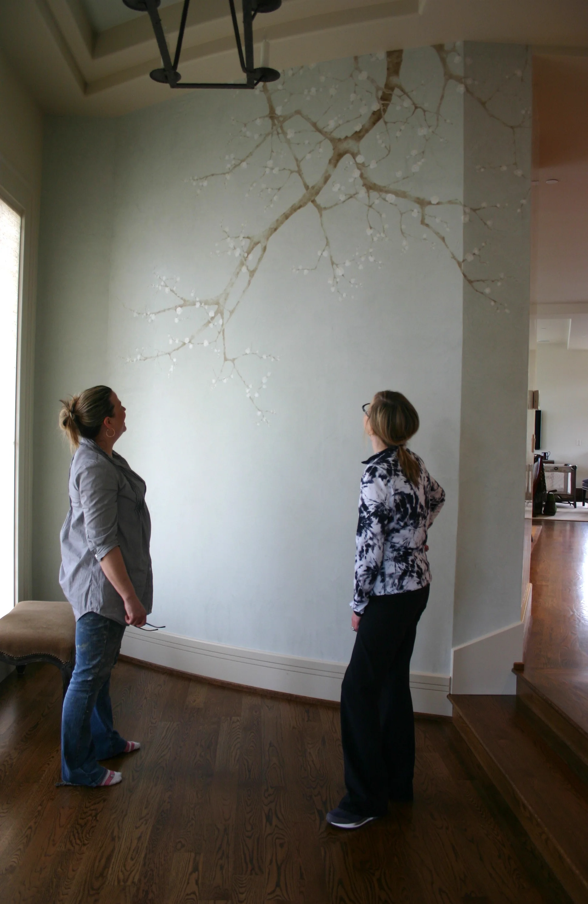 Cherry tree branch painted over a newly plastered wall. Very nerve wracking!